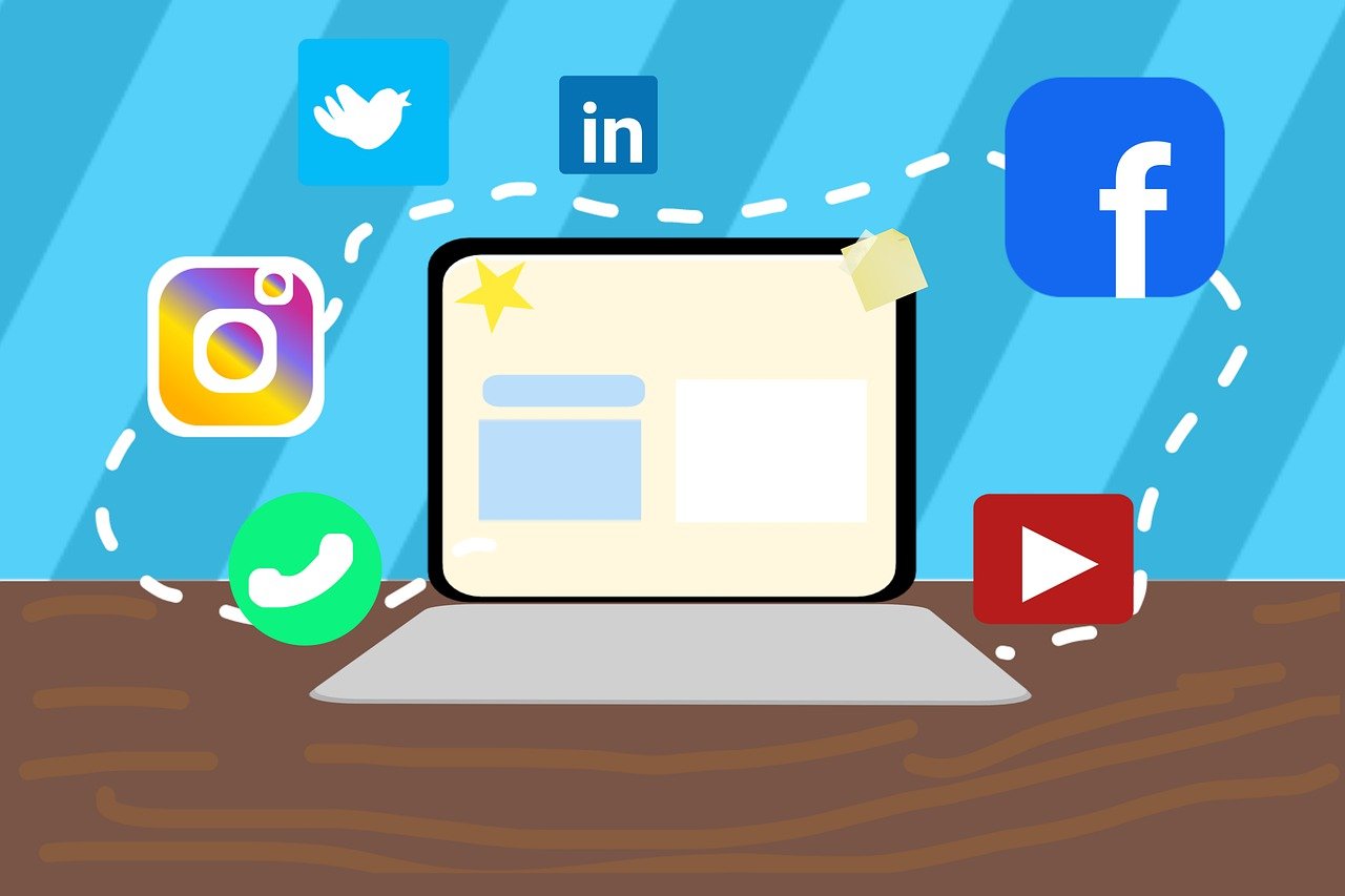 Graphic image of a computer with logos of various Social Media platforms hovering around.
