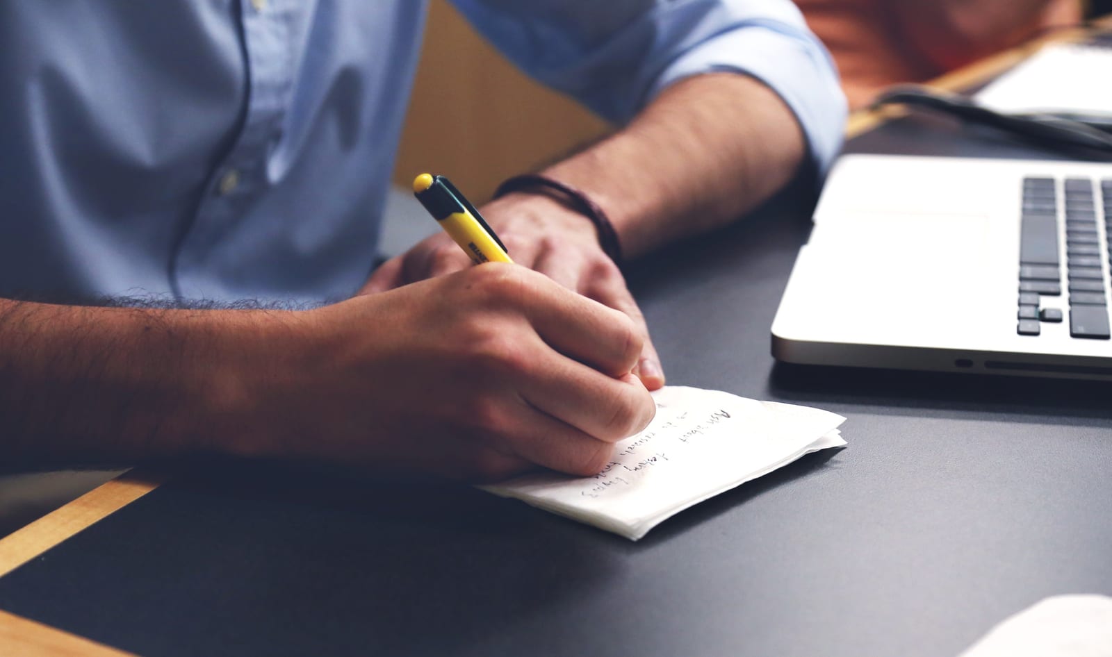 Man writing a checklist
