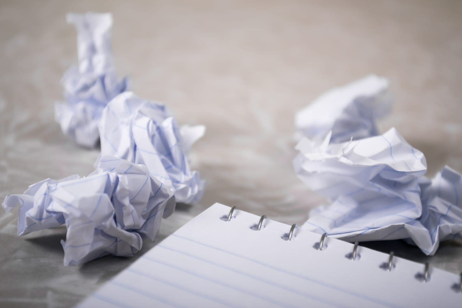 Crumbled paper and notepad