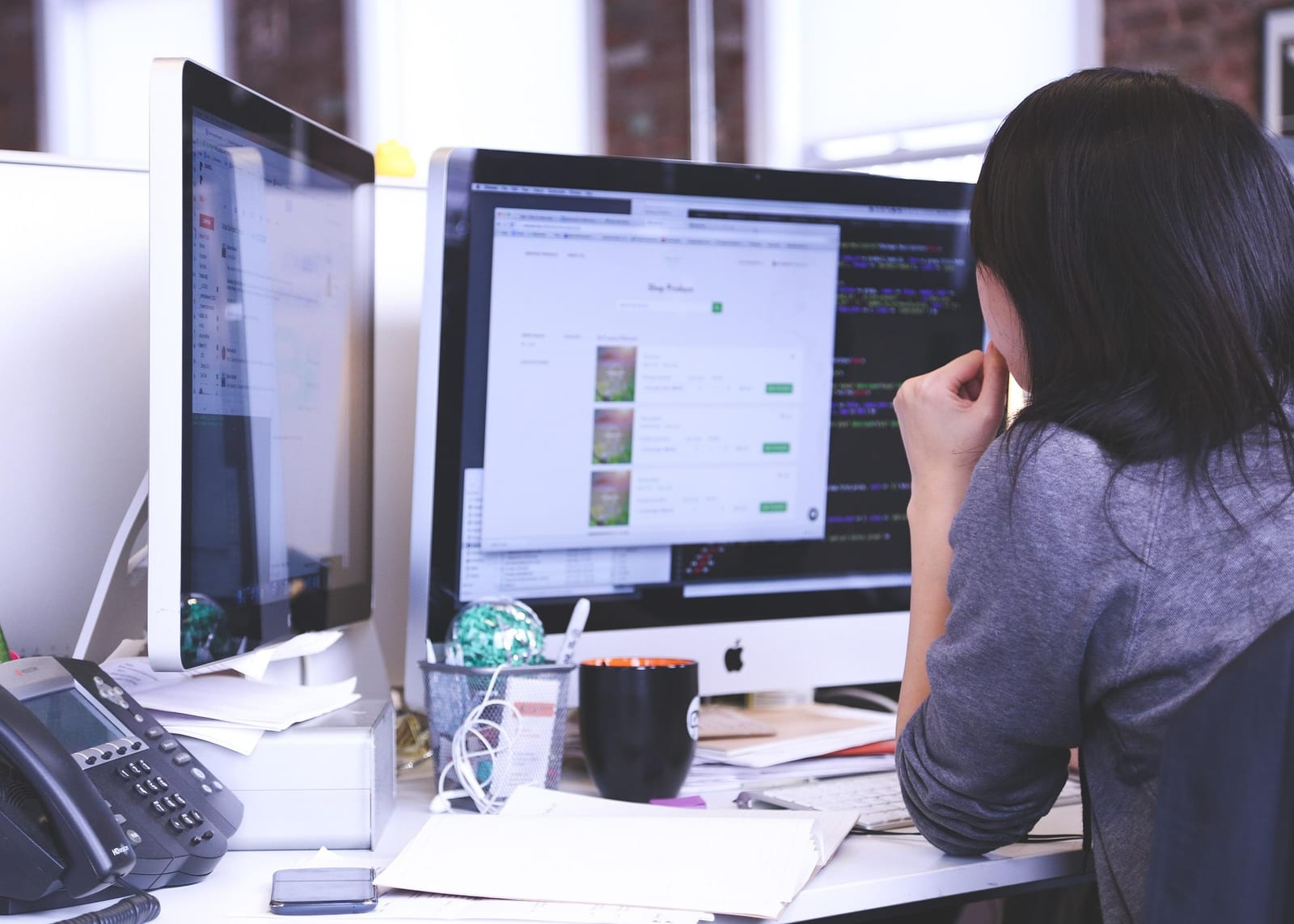 Business Owner reviewing website on a computer on their desk